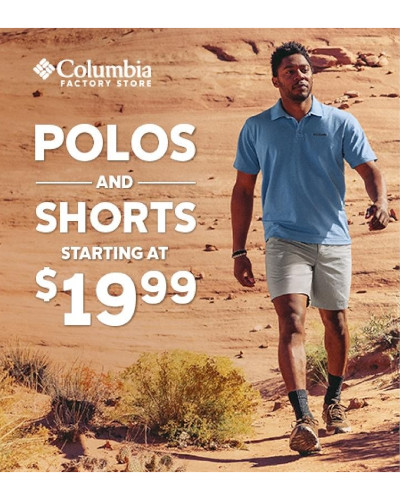 man hiking in polo and shorts