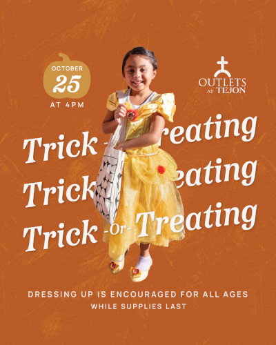 trick or treating event showing girl in dress with bag
