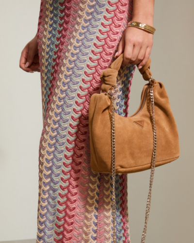 vertical stripped long skirt and brown suede handbag