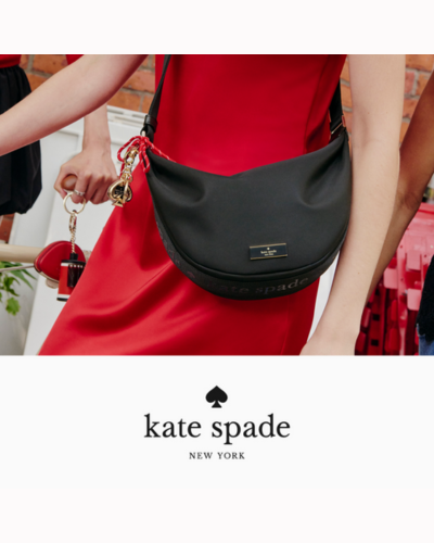 woman in red dress with black moon shaped purse