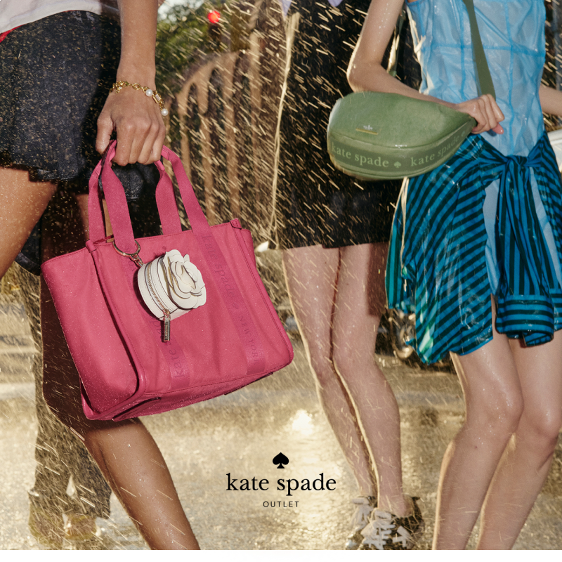female models in skirts holding purses while it rains