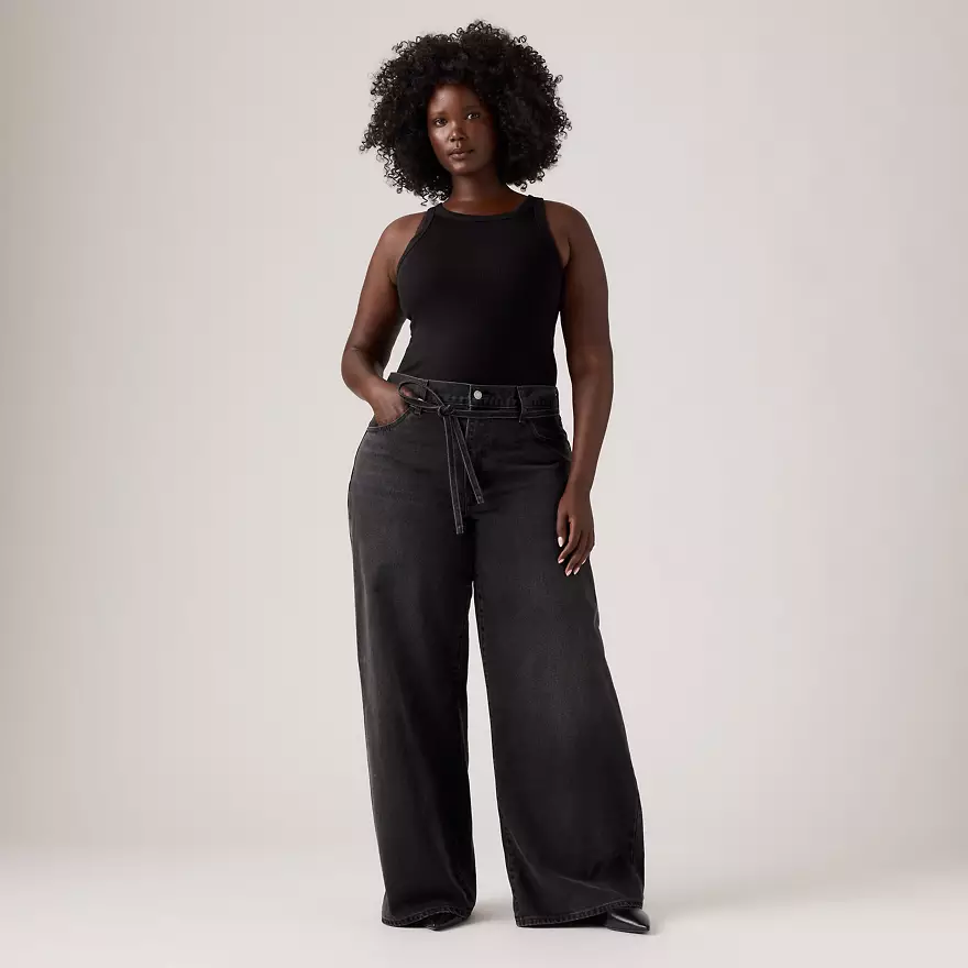 Female Levi Model wearing black jeans and tank top