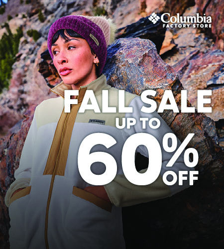 female model in light jacket and beanie in outdoor setting