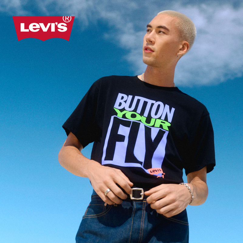 model with blue sky and button fly graphic-t