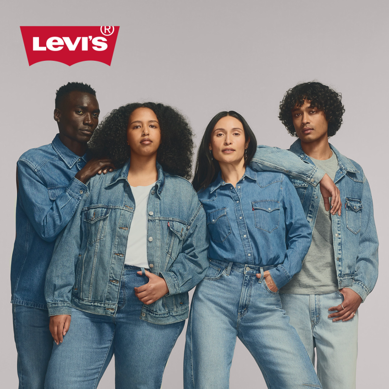 a group of models in jeans, denim jackets, and denim shirts