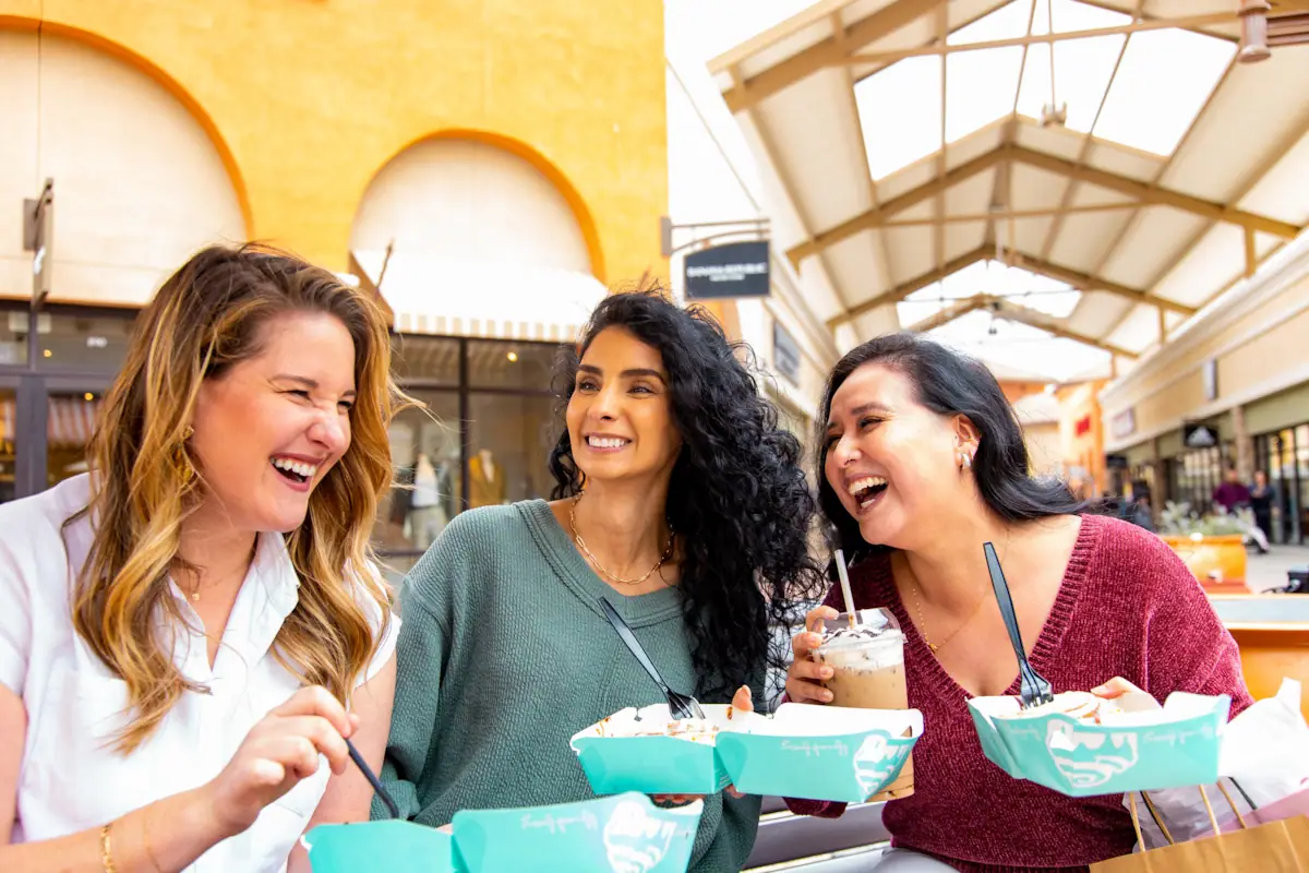 Group of Women Eating Happily at Outlets at Tejon