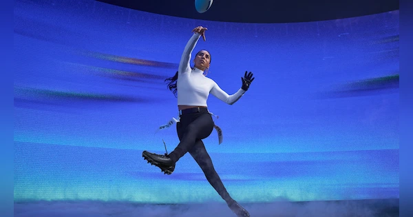 Lady jumping wearing Under Armour apparel - Wide Photo