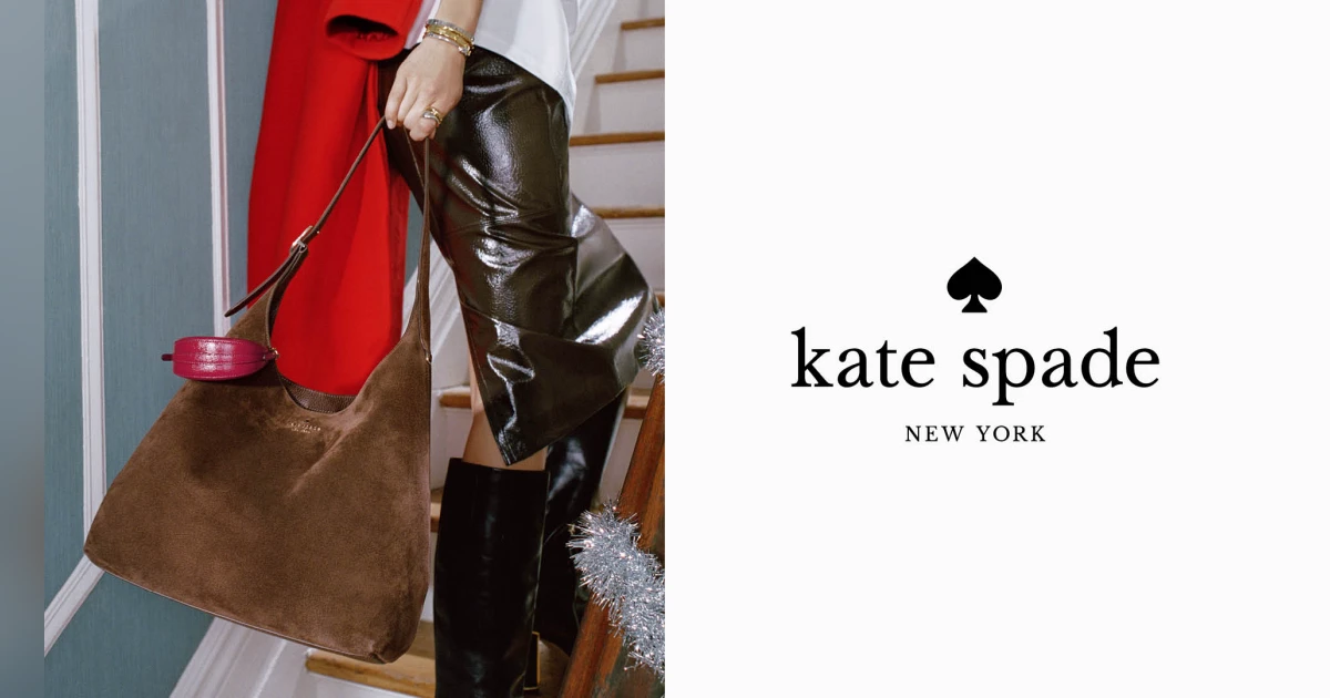 Woman going up stairs with Kate Spade logo