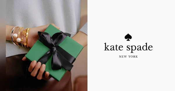 woman holding green gift box and Kate Spade logo