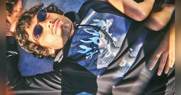 Selfie of man wearing shades and psycho bunny shirt