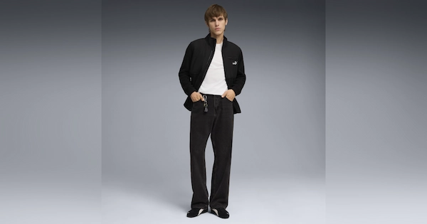 Young man with black and white clothes standing posing