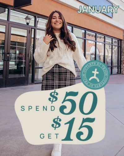 Girl standing with banner of sale for Tejon Outlets