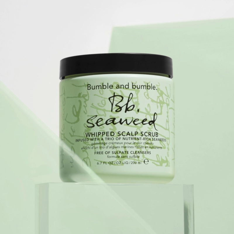  Close up of green bottle of scalp scrub beauty product