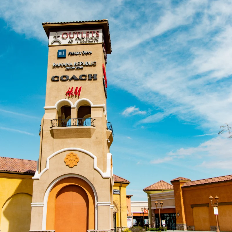 Tejon outlets billboard tower with different store logos on them
