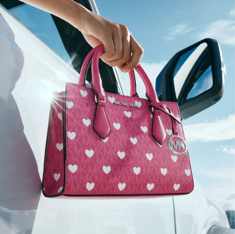 Michael kors hand bag with heart patterns
