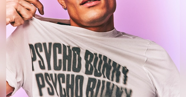 Man wearing Psycho Bunny shirt and pulling on it