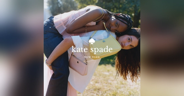 Woman with Kate Spade handbag carrying another woman on her back