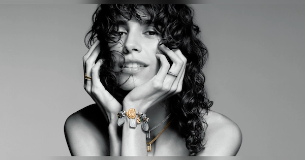 Woman with curly hair wearing bracelet from Pandora Jewelry