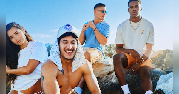 Young people on boulder wearing Psycho Bunny gear