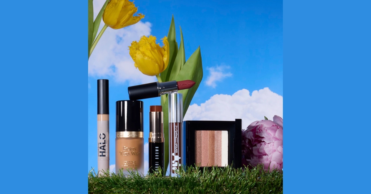Make up accessories on green grass and blue sky