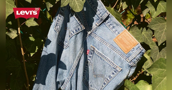 Levi's jeans with green leaves around it