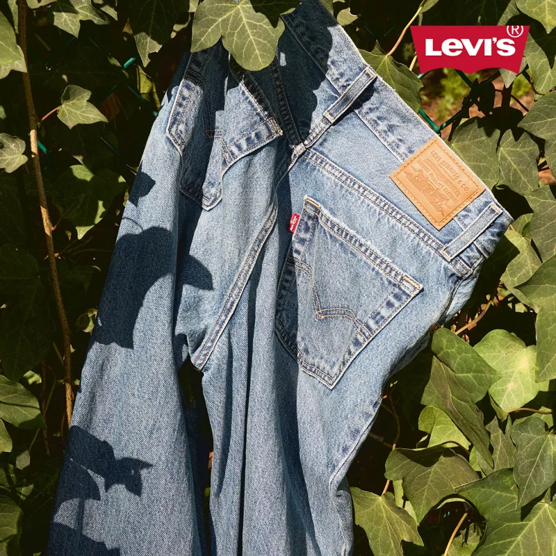 Levi's jeans with green leaves around it