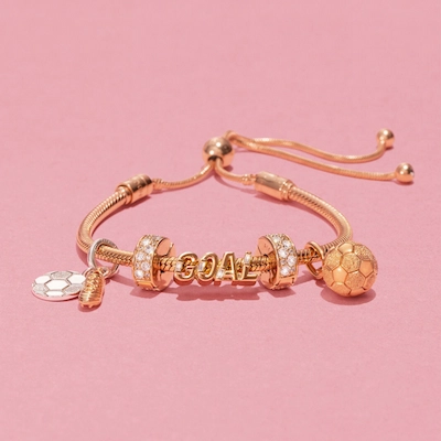 Gold pandora bracelet with goal lettering