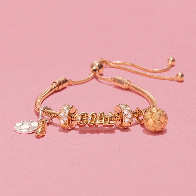 Gold pandora bracelet with goal lettering