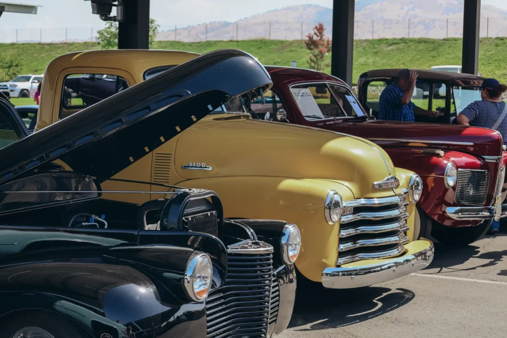 Vintage pickup trucks lined up for car show