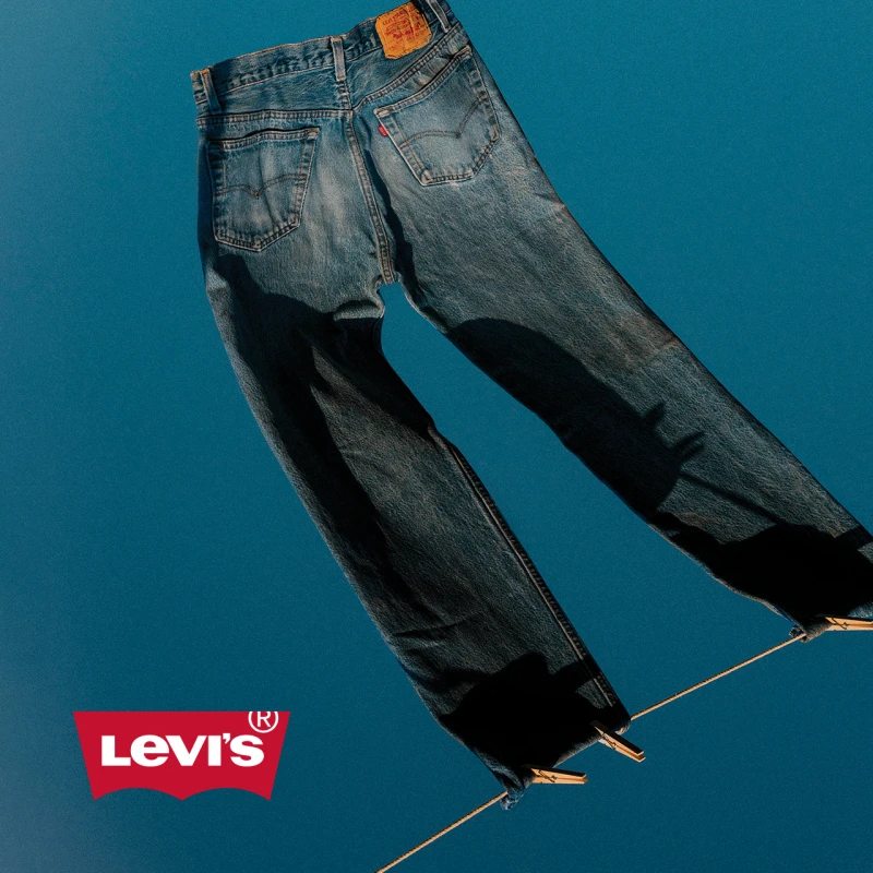 Levi's jeans handing on wire