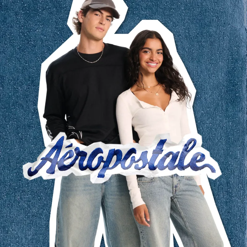 Man wearing black sweater and woman wearing white long sleeve from Aeropstale