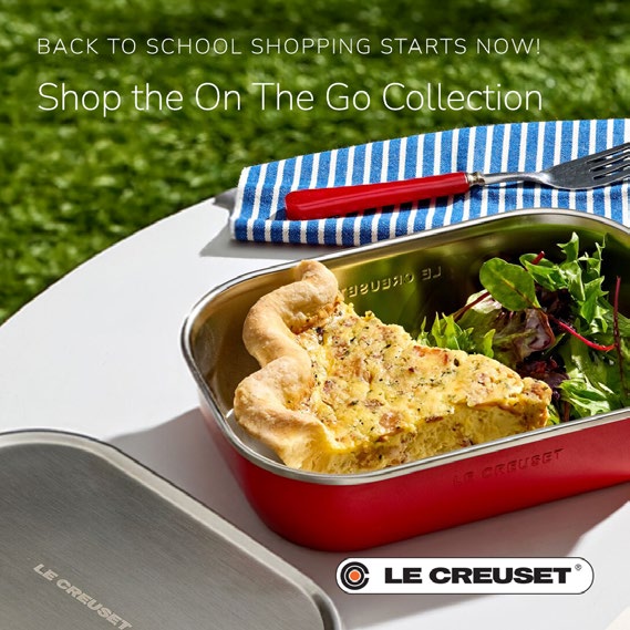 Steel lunch box on white table outdoors