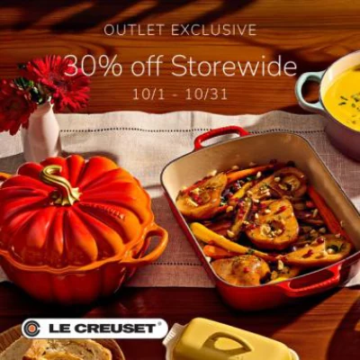 Le Creuset pumpkin cocotte and roasting dish on a table