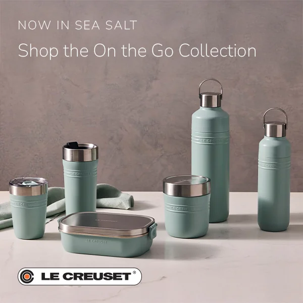 Le Creuset On the Go tumblers, water bottles and food containers in Sea Salt on a marble counter